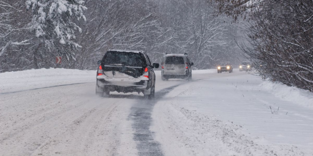 car driving down a snowy road